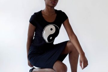 black skirt and black tee with ying-yang print