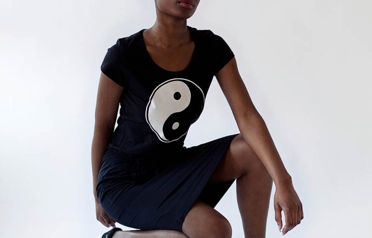 black skirt and black tee with ying-yang print